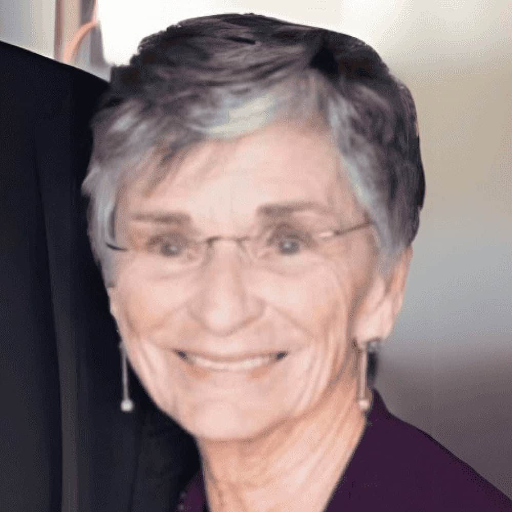 Smiling elderly woman at Illinois Association of Community Action Agencies event.