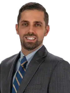 Professional man in suit at Illinois Community Action Agencies webinar.